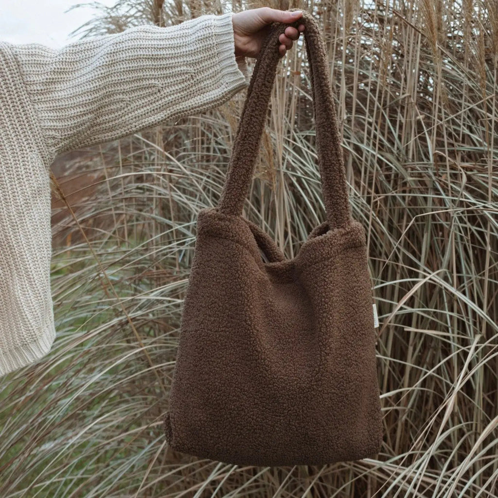 Reusable teddy fabric tote bag by Dans Le Sac, showing a soft, plush exterior and sturdy handles for everyday use.