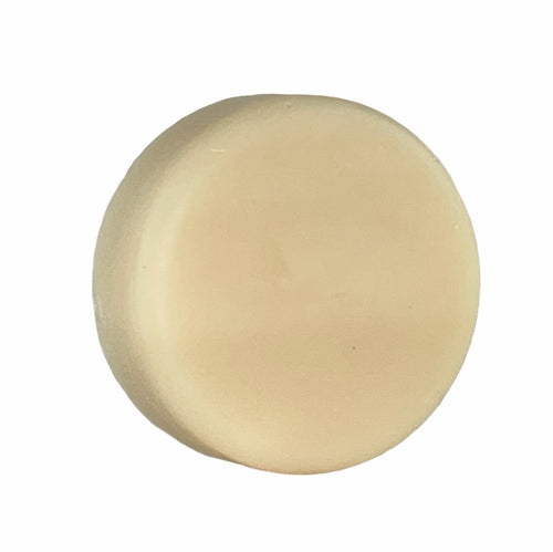 OC Beauty Co. After Hours Shave Soap in a round container with a smooth, creamy texture and a dark label, suitable for a close shave.