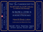 The InnerCandescent Co Aurora Citrus hand and body lotion bottle with bright citrus scent and luxurious moisturizing formula.