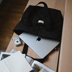 Recyclable quilted tote bag for daily use by Dans Le Sac, featuring a padded, reusable design with sturdy handles.