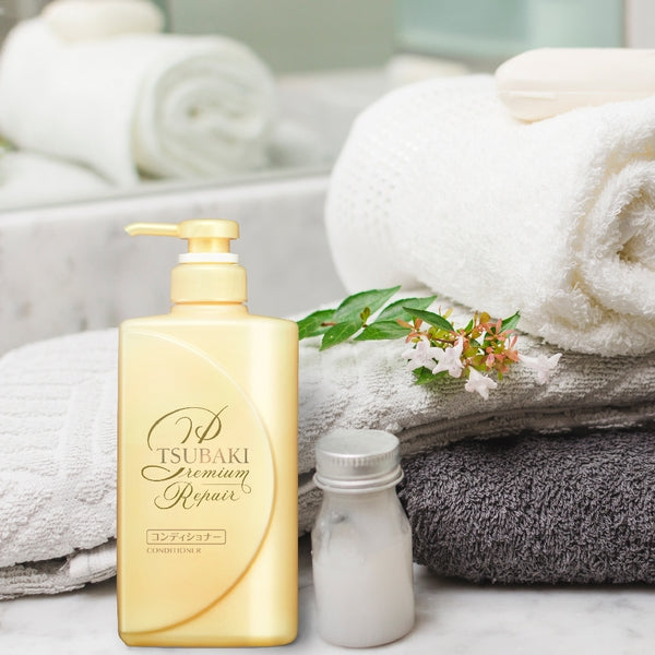 Shiseido Tsubaki Premium Repair Hair Conditioner 490ml in a gold bottle, designed to nourish and repair damaged hair.