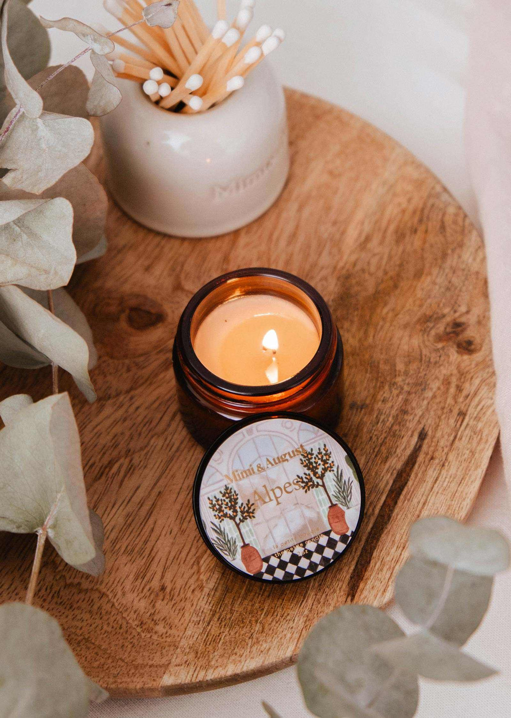 Mini Alpes candle by Mimi & August in a 2 oz glass container, featuring a cozy, minimalist design and natural wax finish.