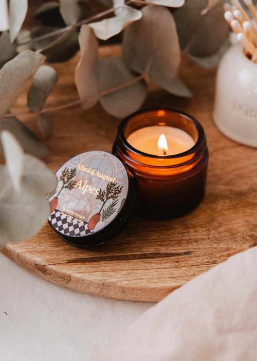 Mini Alpes candle by Mimi & August in a 2 oz glass jar, featuring a cozy, textured design and warm, inviting scent.