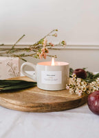 Mimi & August Artea reusable soy candle in a 5oz glass jar, featuring a minimalist label and a lit wick.
