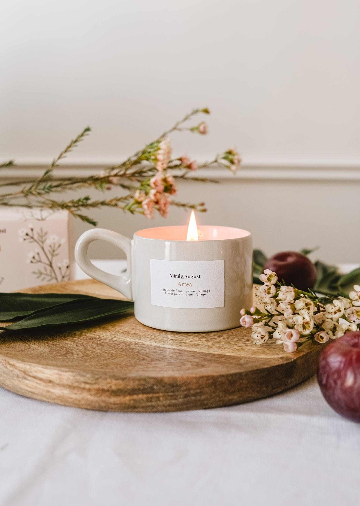 Mimi & August Artea reusable soy candle in a 5oz glass jar, featuring a minimalist label and a lit wick.