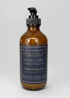 The InnerCandescent Co Aurora Citrus hand and body lotion bottle with bright citrus scent and luxurious packaging.