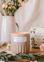 Botanica reusable candle in 11oz jar by Mimi & August, natural botanical design, wax candle with a wooden wick.