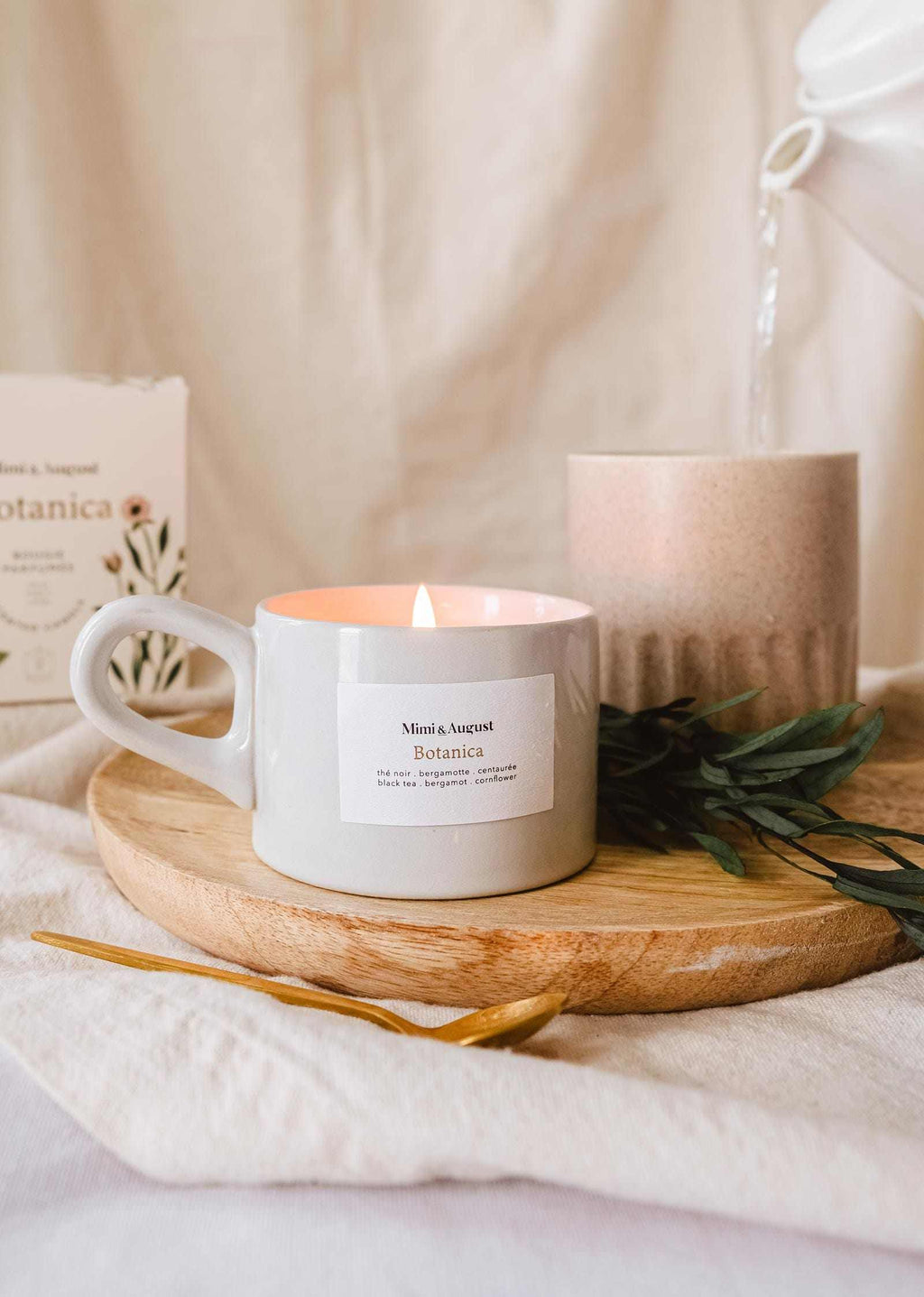 Botanica 5oz reusable candle by Mimi & August, natural soy wax with botanical accents in a sleek glass container.