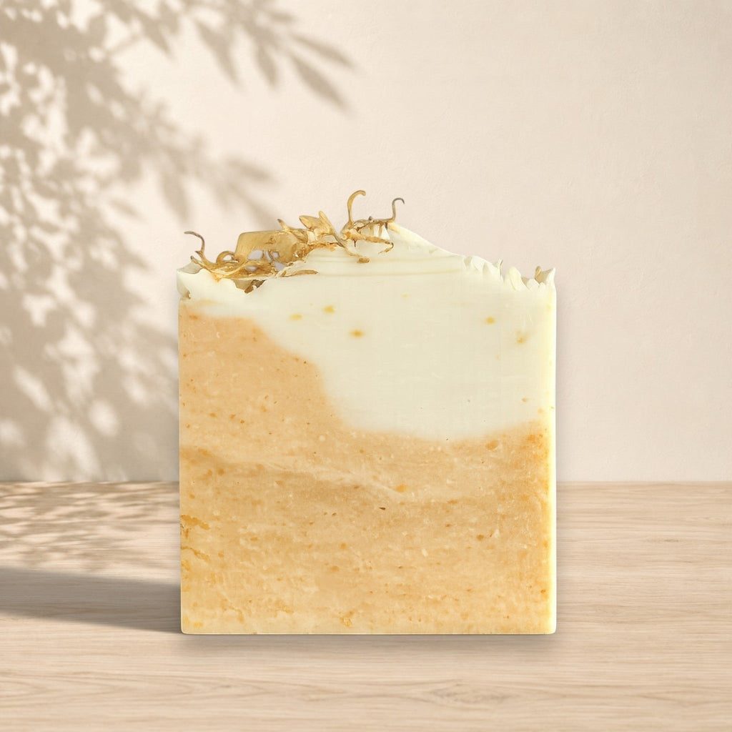 Gentle NÉFERTITI soap by La Sultana Savonnerie with beeswax, turmeric, and calendula, shown as a natural bar of soap.