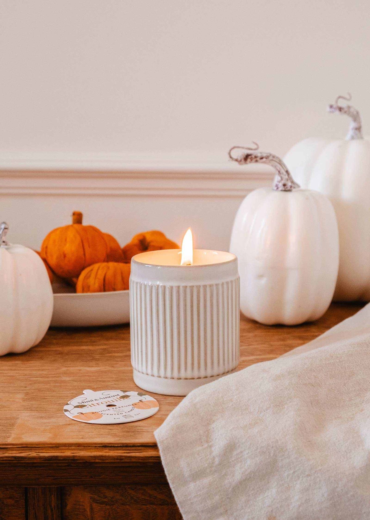 Mimi & August Citrouille reusable soy candle in a decorative pumpkin-shaped container, perfect for home decor.