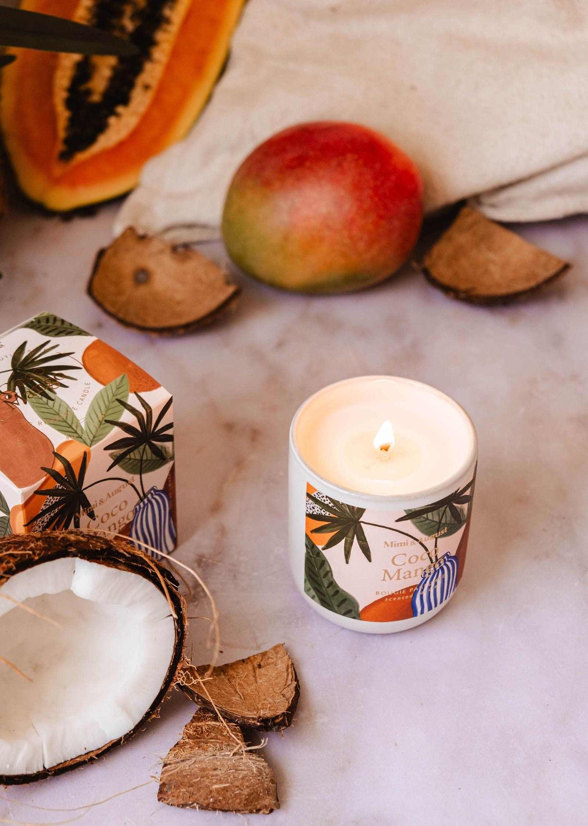 Coco Mango reusable candle by Mimi & August in an 8oz jar with a tropical mango and coconut scent, decorated with a natural wick.