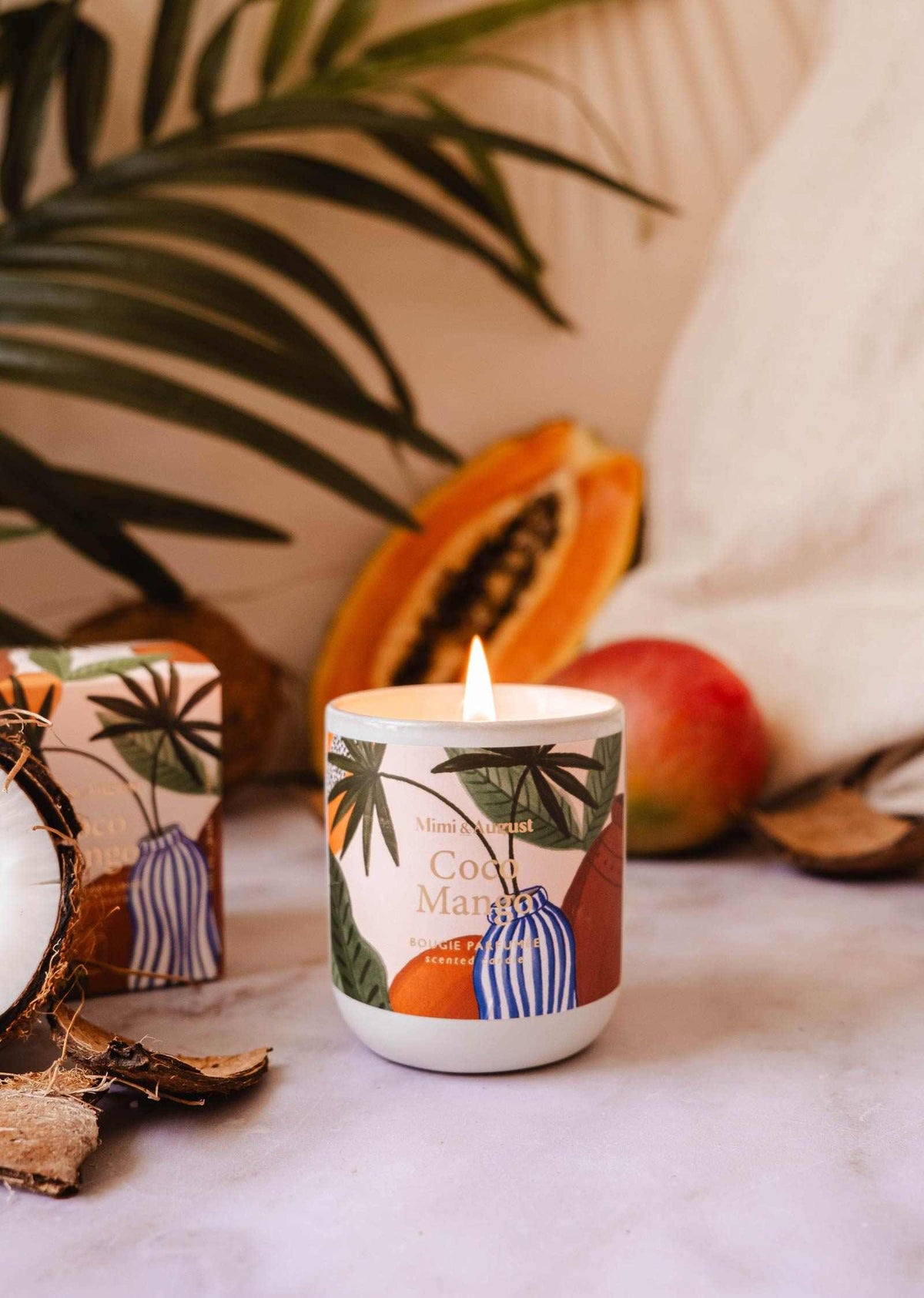 Coco Mango reusable candle by Mimi & August in an 8oz glass jar with a natural coconut mango scent and a clean, modern design.