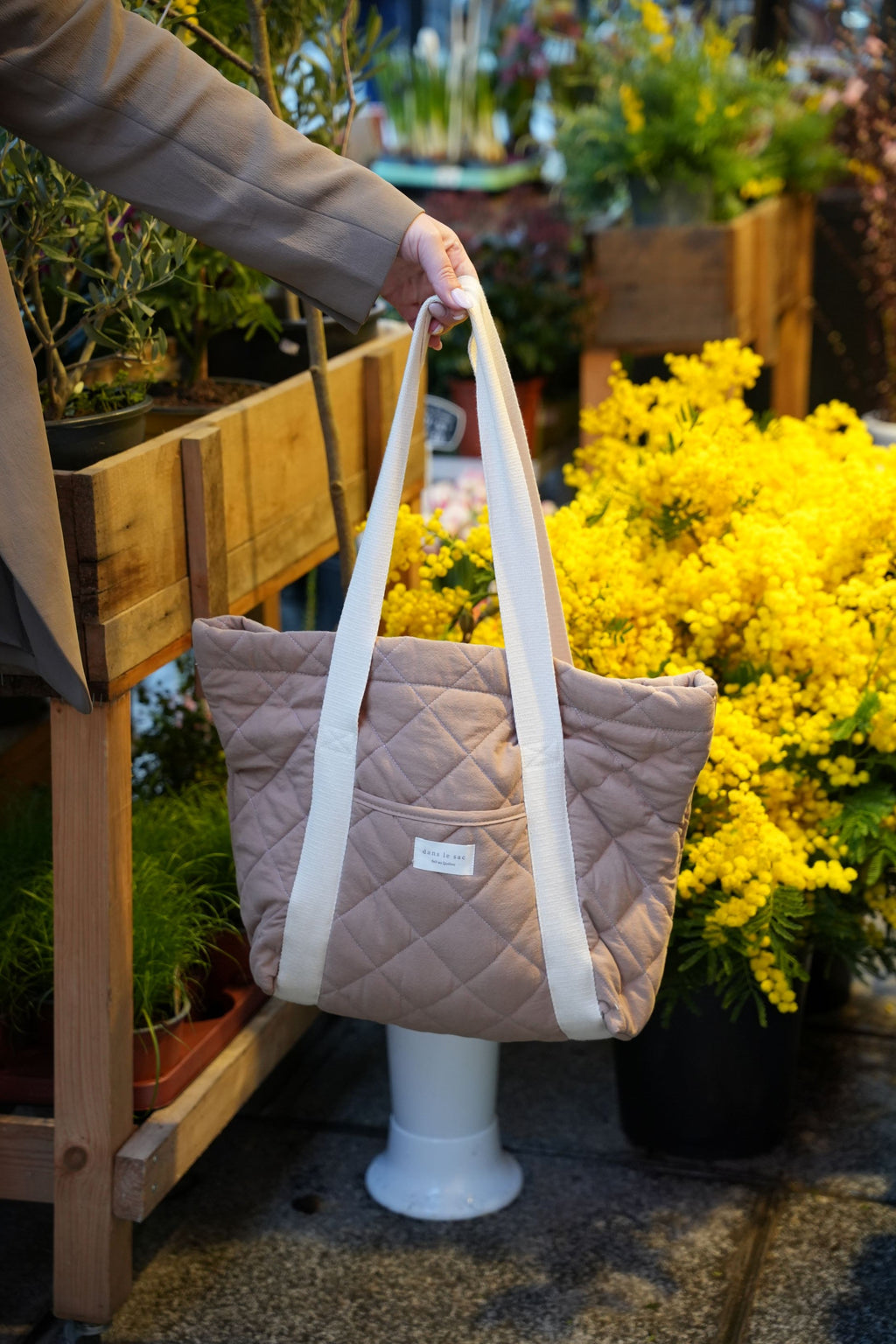 Reversible quilted tote bag by Dans Le Sac, reusable daily carryall with quilted design and sturdy handles.