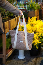 Reversible quilted tote bag by Dans Le Sac, reusable daily carryall with quilted design and sturdy handles.