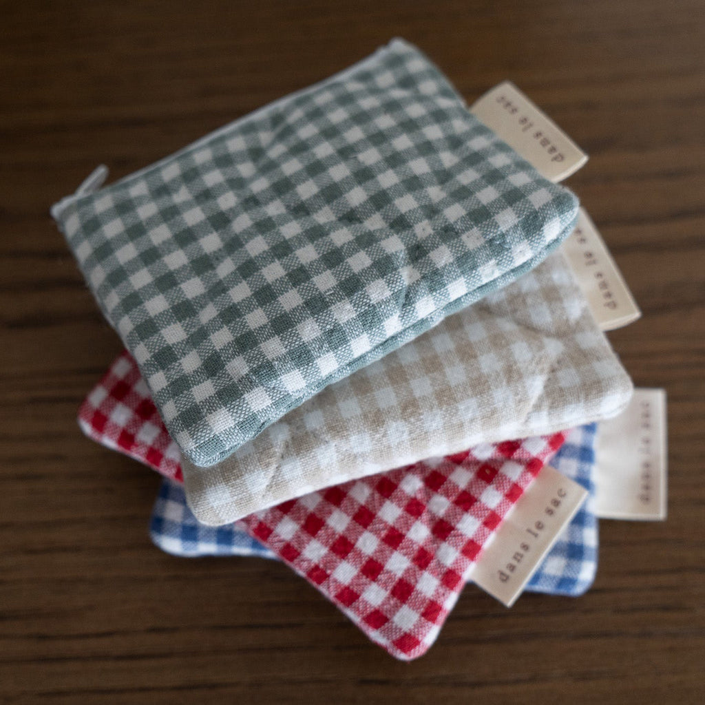 Reversible quilted cotton coin purse from Dans Le Sac, showcasing soft fabric and compact, stylish design.