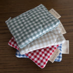 Reversible quilted cotton coin purse from Dans Le Sac, showcasing soft fabric and compact, stylish design.