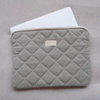 Dans Le Sac fabric laptop sleeve with a sleek design, featuring a soft interior and secure zipper closure for protection.