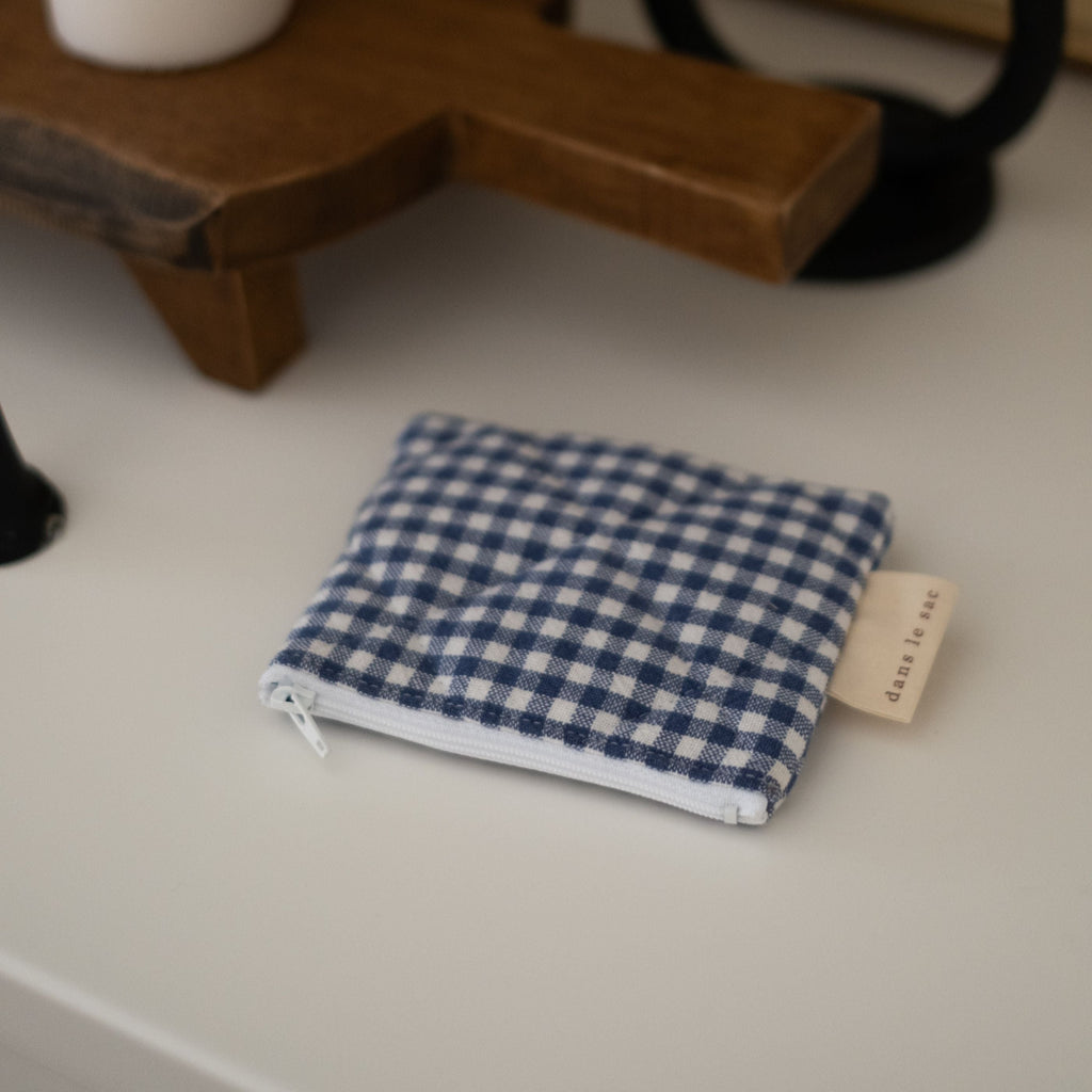 Reversible quilted cotton coin purse by Dans Le Sac, small reusable wallet with soft, padded texture and zipper closure.