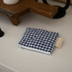 Reversible quilted cotton coin purse by Dans Le Sac, small reusable wallet with soft, padded texture and zipper closure.