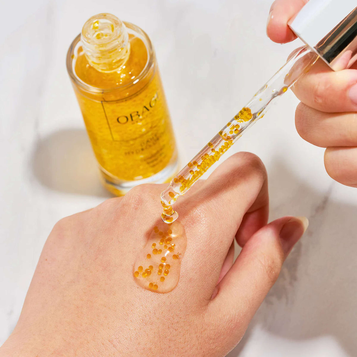 wedoskin Obagi Daily Hydro Drops facial serum bottle with dropper, showcasing clear, lightweight hydrating serum for smooth skin