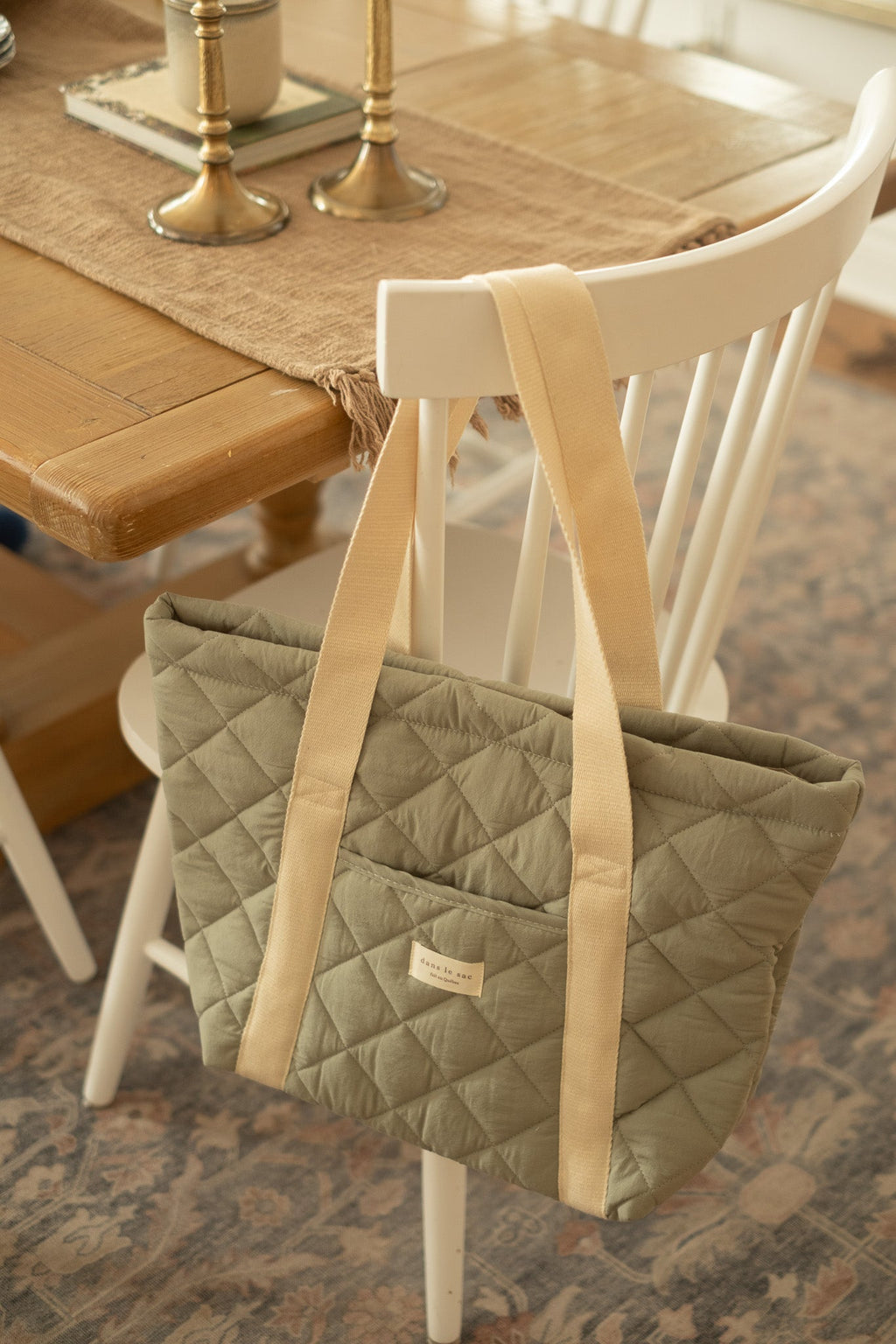 Reusable quilted tote bag for everyday use by Dans Le Sac, featuring a stylish, padded design with sturdy handles.