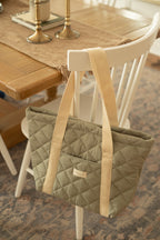 Reusable quilted tote bag for everyday use by Dans Le Sac, featuring a stylish, padded design with sturdy handles.