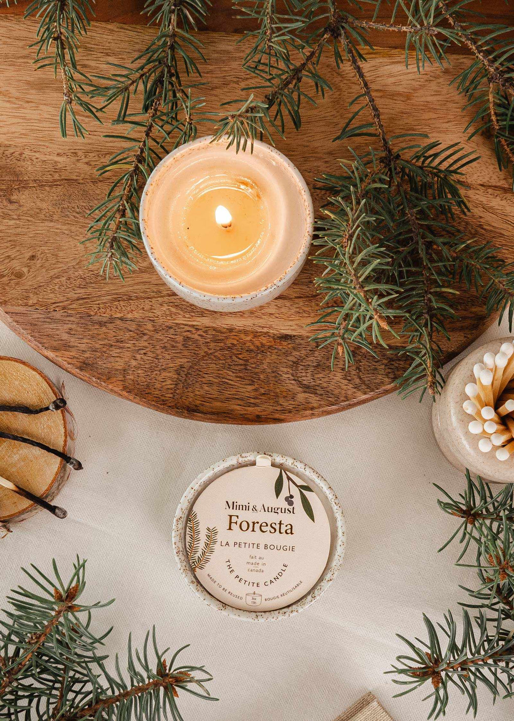 Mimi & August Foresta reusable candle in a glass holder with a natural wooden lid, eco-friendly candle for cozy decor.