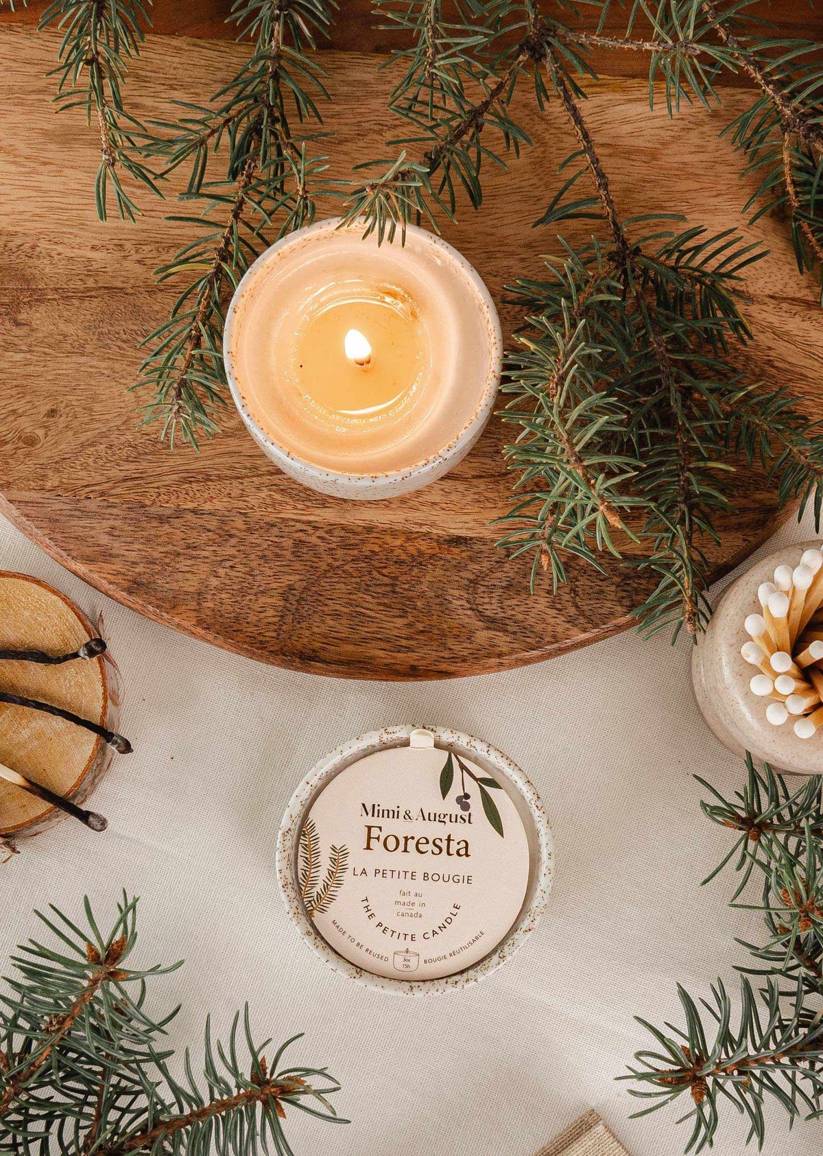 Mimi & August Foresta reusable candle in a glass holder with a natural wooden lid, eco-friendly candle for cozy decor.