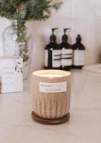Foresta reusable candle by Mimi & August showing a natural wood-inspired design in a clear glass container.