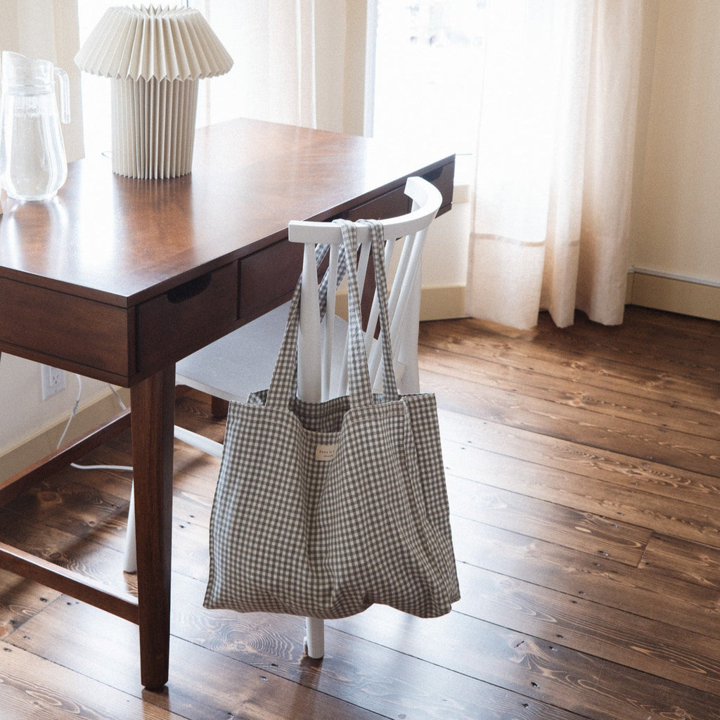 Reusable cotton tote bag from Dans Le Sac's Vichy collection, featuring a classic checkered pattern and sturdy handles.