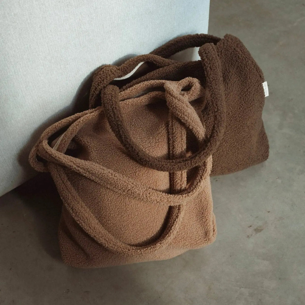 Reusable teddy fabric tote bag by Dans Le Sac, perfect for work, with soft plush material and spacious interior.