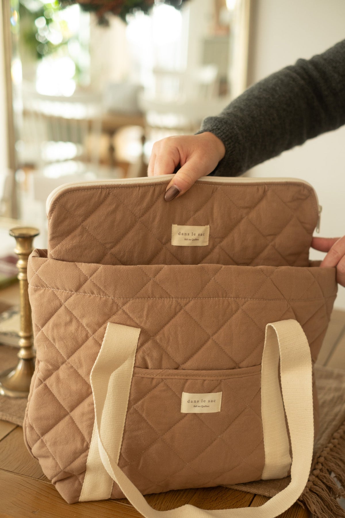 Reversible quilted tote bag from Dans Le Sac with compartments for laptop and daily essentials, stylish and reusable.