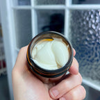 Natural face moisturizing cream by La Sultana Savonnerie with chaga and mango butter, shown in a jar with creamy texture.