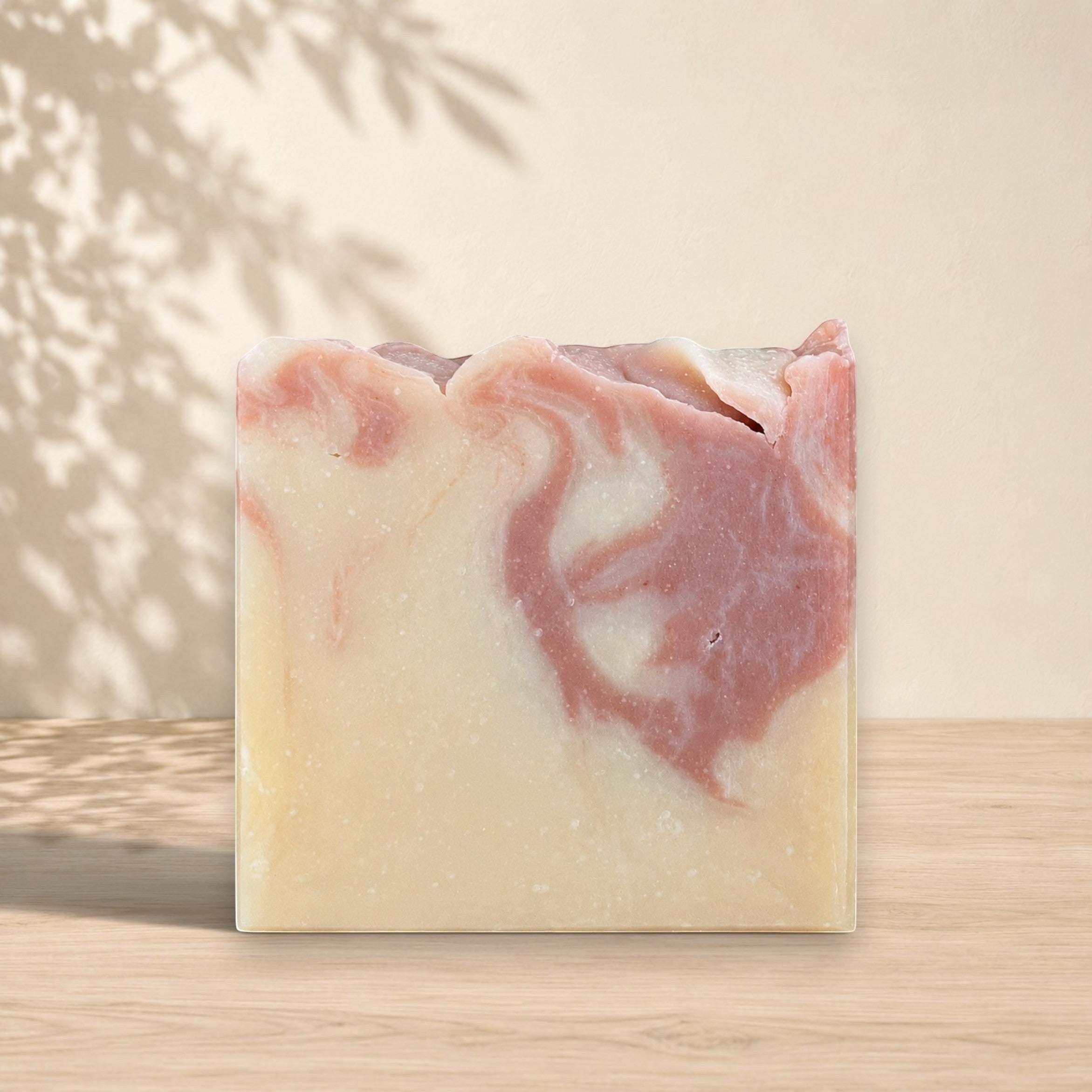 Red clay and ginger pamplemousse soap by La Sultana Savonnerie, handcrafted natural soap with vibrant red color and fresh ingredients.