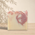 Red clay and ginger pamplemousse soap by La Sultana Savonnerie, handcrafted natural soap with vibrant red color and fresh ingredients.