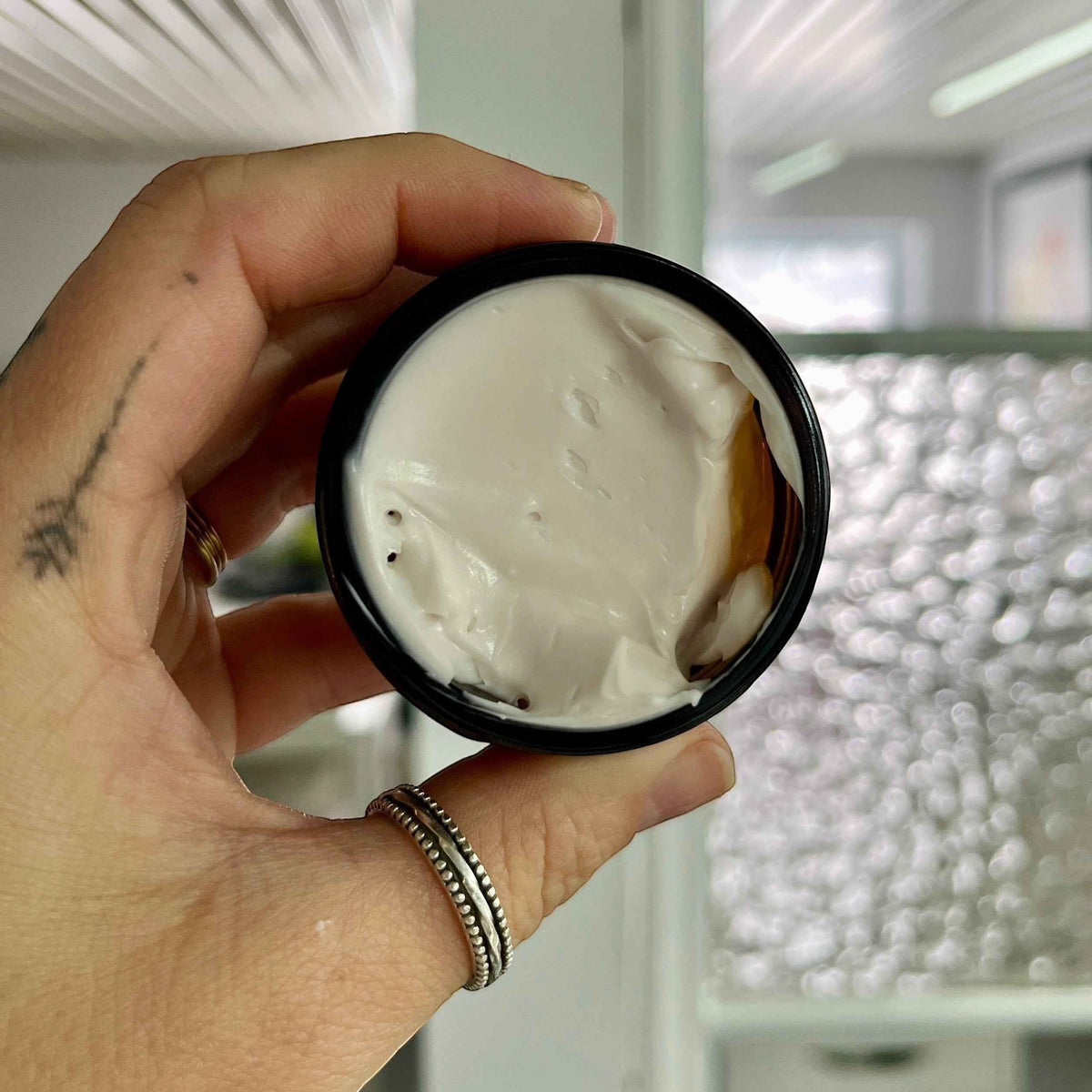 Creamy face night cream with bakuchiol and cranberry from La Sultana Savonnerie, natural skincare product in a jar.