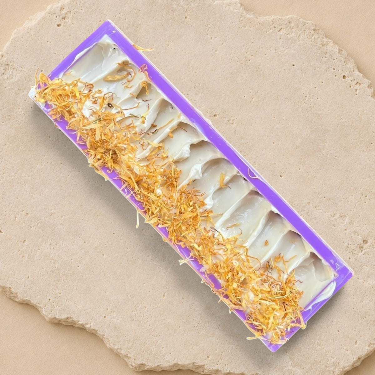 Gentle soap bar with bee wax, turmeric, and calendula by La Sultana Savonnerie, natural handcrafted soap in a full view.