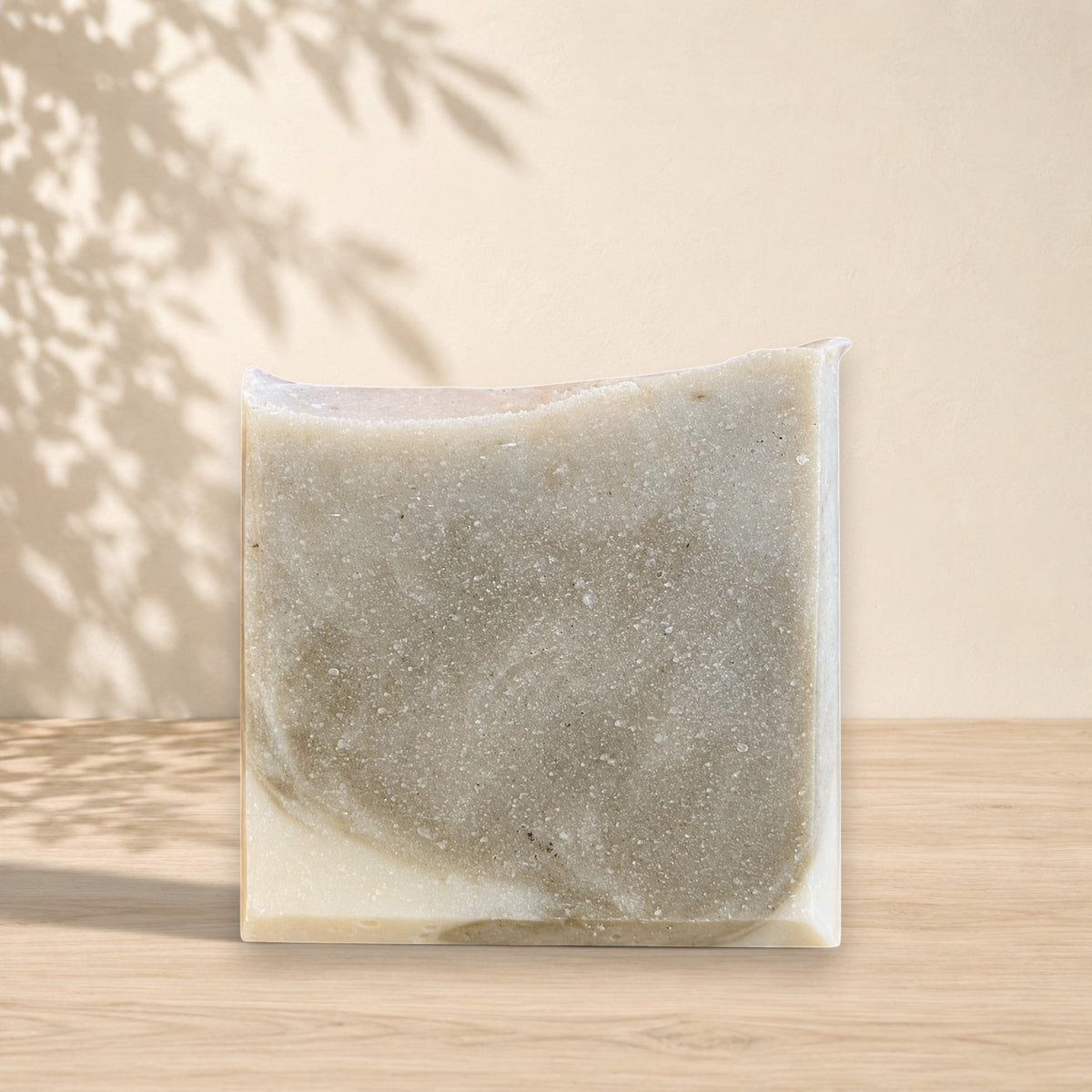 Natural handmade indigo and myrrh soap bar by La Sultana Savonnerie, showcasing a rectangular soap with rich blue and earthy tones.