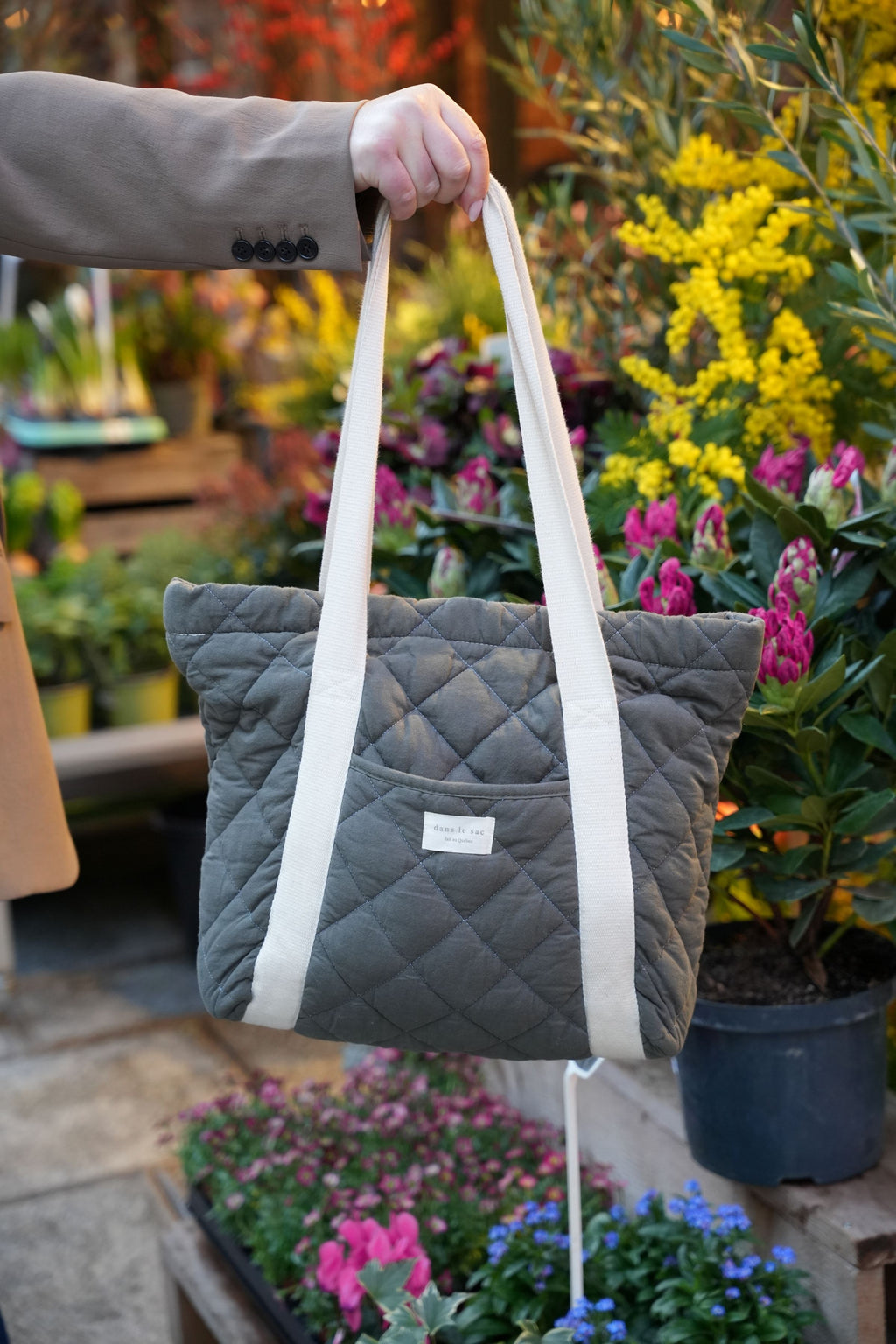 Large quilted tote bag with exterior pocket from Dans Le Sac, reusable daily carry bag for everyday essentials.
