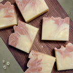 Red clay soap by La Sultana with ginger and grapefruit, featuring a natural handmade appearance and fresh citrus and ginger scent.