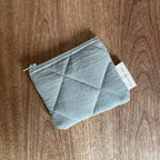 Recycled cotton quilted wallet from Dans Le Sac, a reusable fabric pouch with a textured, padded surface.