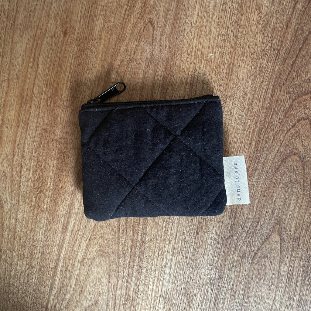 Reusable Dans Le Sac quilted cotton coin purse with a soft, padded design and a compact, stylish look.