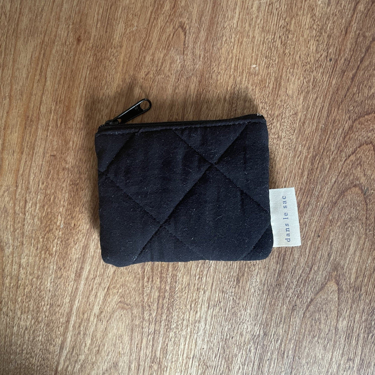 Reusable Dans Le Sac quilted cotton coin purse with a soft, padded design and a compact, stylish look.