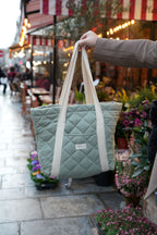 Interior view of Dans Le Sac quilted reusable tote bag with multiple storage pockets for daily essentials.