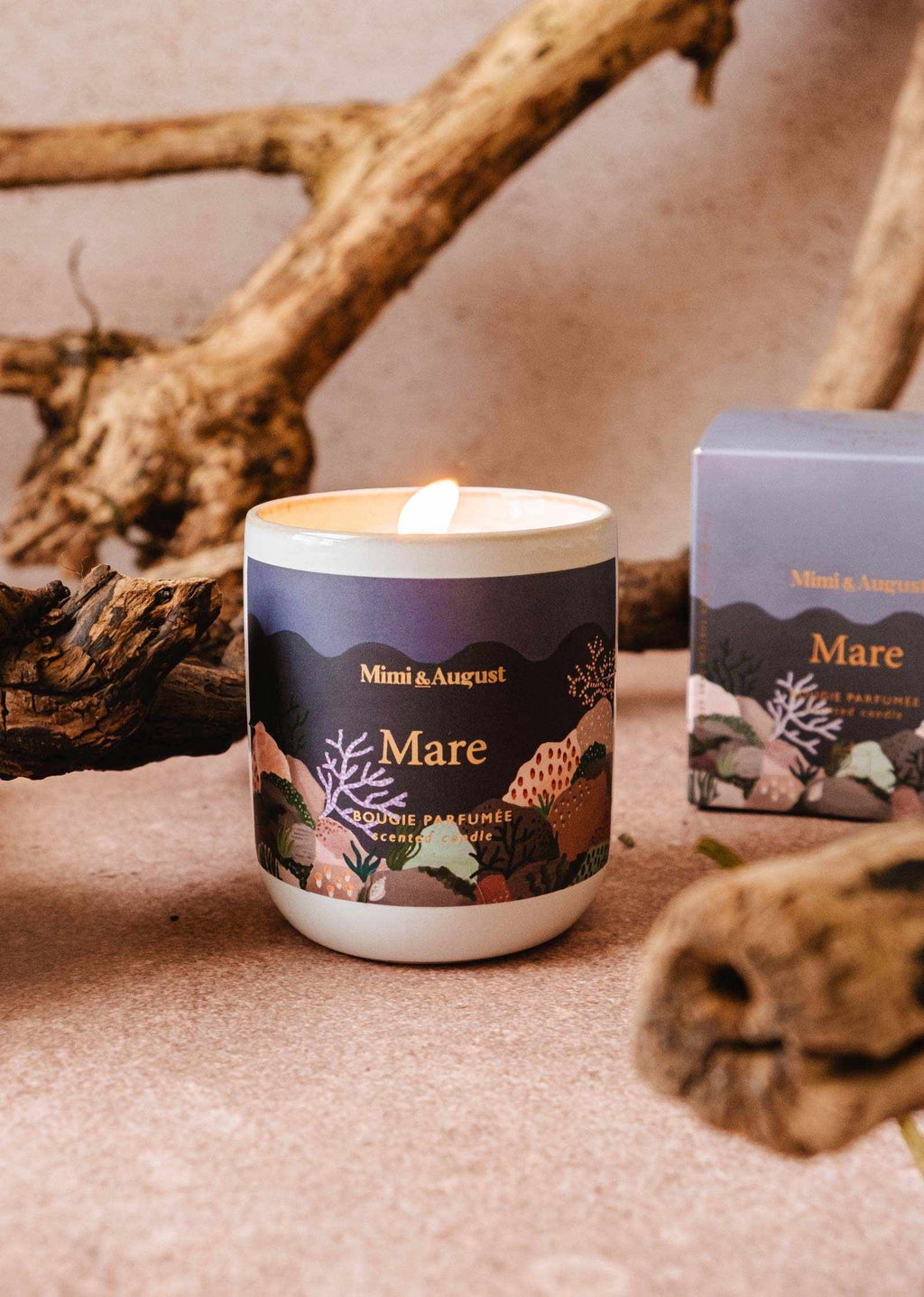 Mare reusable 8oz candle by Mimi & August featuring a sleek glass jar and a lit natural wax candle for cozy ambiance.
