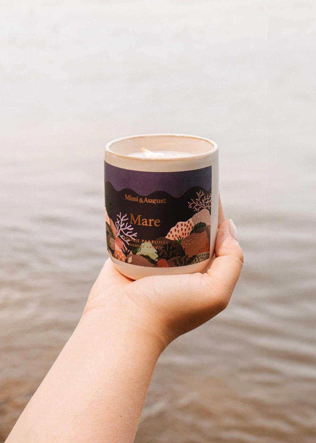 Mare reusable candle in an 8oz glass jar from Mimi & August, with a natural wax finish and a cotton wick.