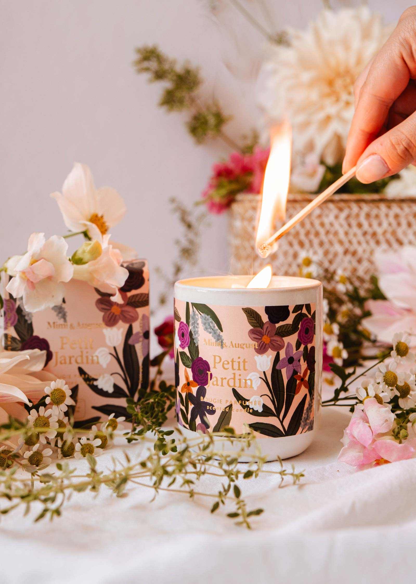 Mimi & August Petit Jardin reusable 8oz candle with botanical design, natural wax, and wooden wick in a clear glass jar.