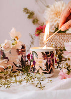 Mimi & August Petit Jardin reusable 8oz candle with botanical design, natural wax, and wooden wick in a clear glass jar.