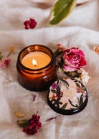Mini 2 oz Petit Jardin soy candle by Mimi & August in a glass jar, featuring a natural botanical-inspired design.