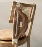 Dune-colored corduroy Dans Le Sac reusable zippered waist bag with adjustable strap on a white background.